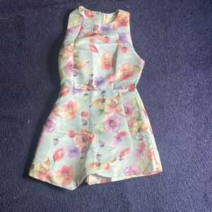 Mustard seed romper.  Size small.  Floral design on mint green color.